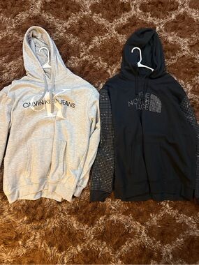 2 Used Men’s Hoodies Calvin Klien, and The Northface size XXL